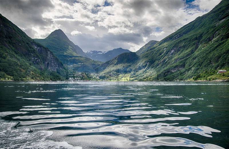 Travel in Norway fjord nature near mountain and water, stock photo