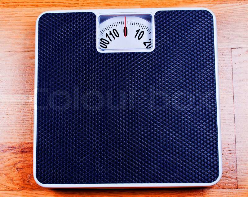 Bathroom Scale close up on plywood, stock photo