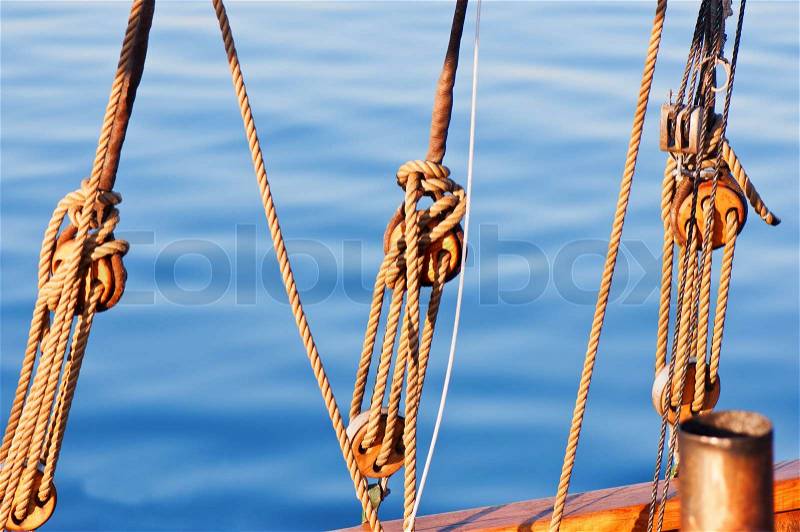 Sail yacht ropes and blocks on a water background | Stock Photo 