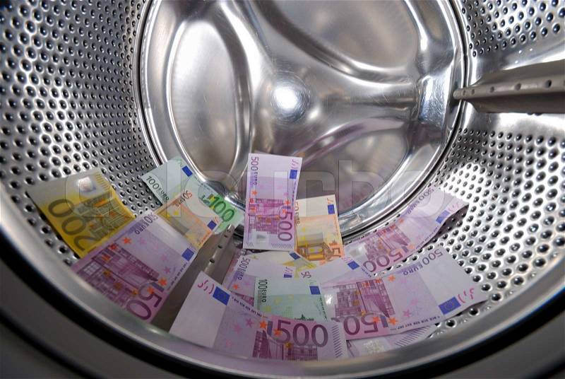 Money laundering in the washing machine, stock photo