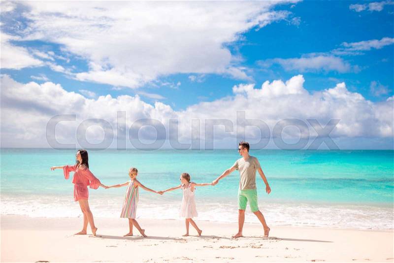 Young family on vacation on the beach. Family travel concept, stock photo