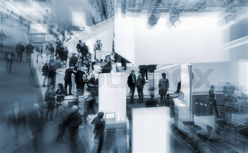 View of a trade fair crowd on a exhibition with fair booths. copyspace for your individual text, stock photo