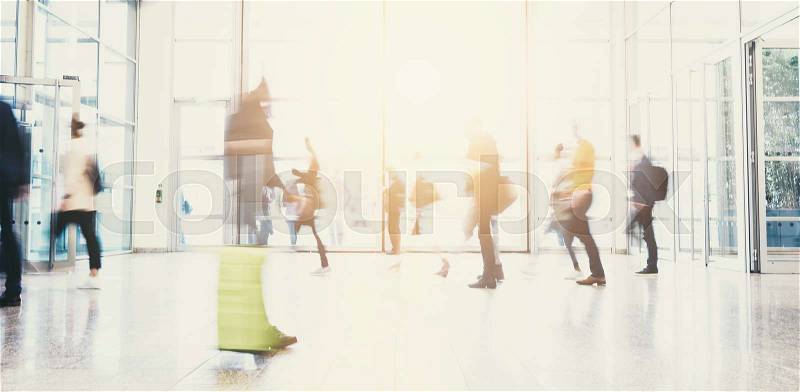 Crowd of commuters rushing at a entrance in a airport. ideal for websites and magazines layouts, stock photo