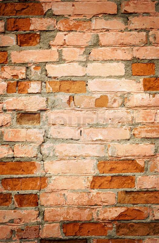 Background of a brick wall with broken bricks, stock photo