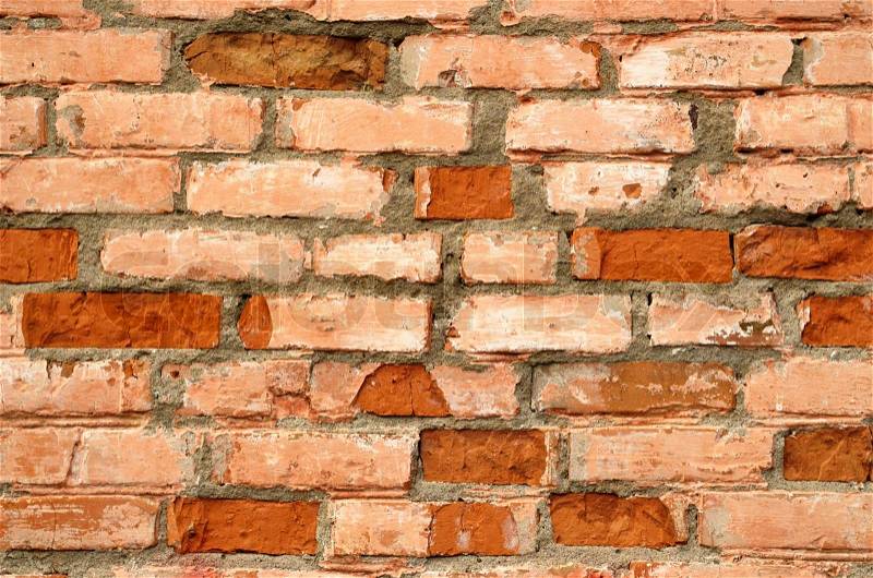 Background of a brick wall with broken bricks, stock photo