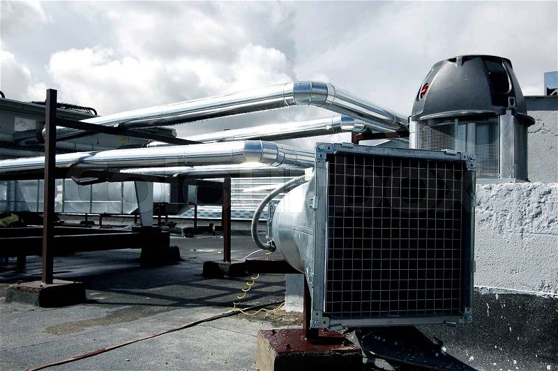 Air-conditioning and heat ducts on a modern building roof Useful file for your company specialized in heating and air-conditioning systems, stock photo