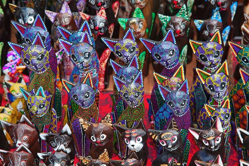 Wooden cats souvenirs made by Balinese wood carvers, stock photo