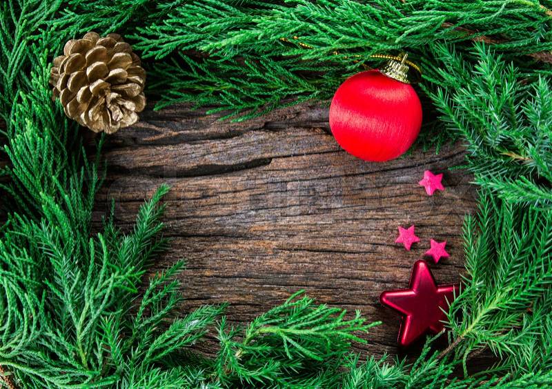 The Christmas ornaments on wooden background as frame border with copyspace, stock photo