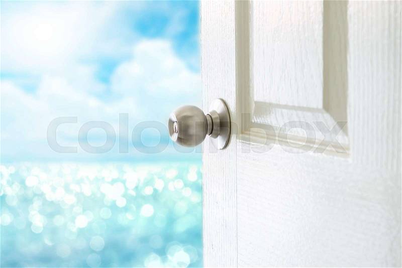 Open the white door to sea view for Hello Summer concept, stock photo