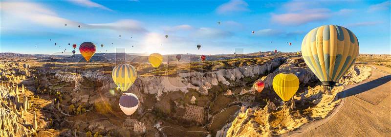 Hot air Balloons flight in Cappadocia, Nevsehir, Turkey in a beautiful summer day, stock photo