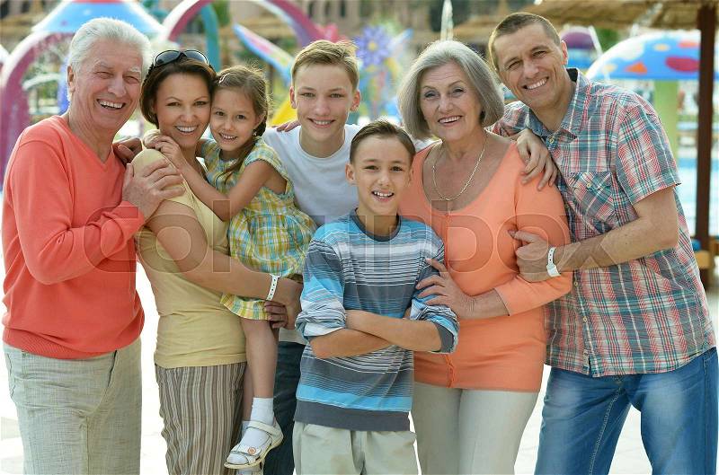 Happy family relaxing at resort during vacation, stock photo