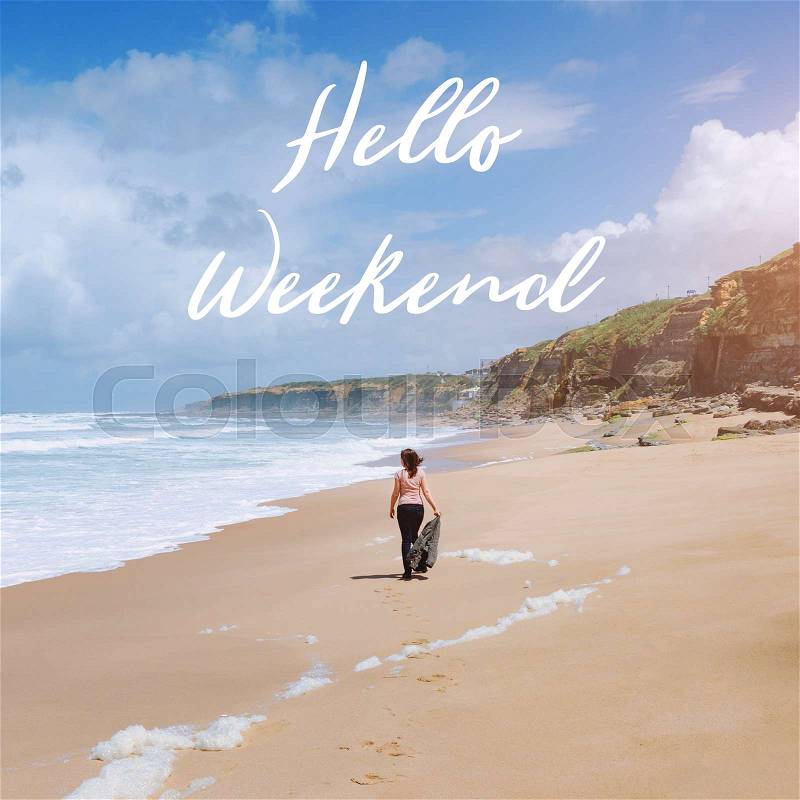 Travel quote, words Hello Weekend. Summer vacation happiness carefree joyful woman standing on sand enjoying tropical beach. Lonely traveler on the ocean coast, stock photo