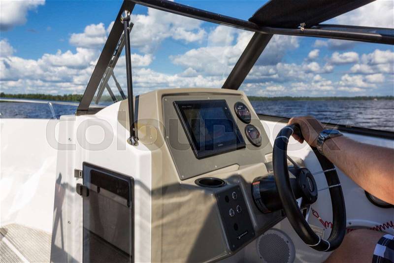 View to lake landscape from motor boat with details of boat, stock photo
