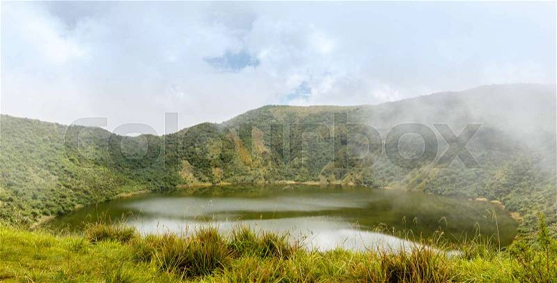 Lake inside Bisoke volcano crater, Virunga volcano national park, Rwanda, stock photo