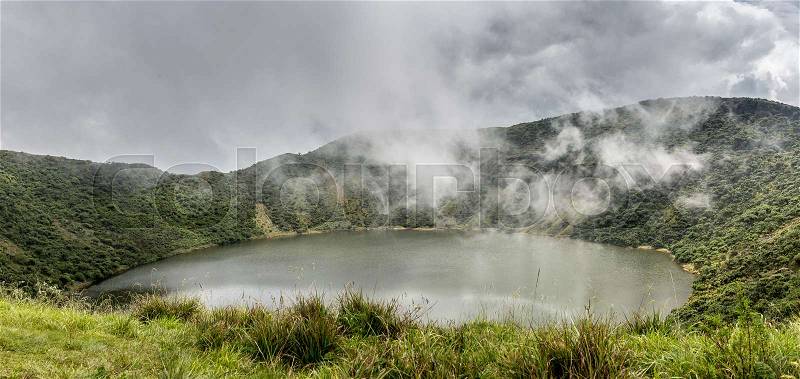 Lake inside Bisoke volcano crater, Virunga volcano national park, Rwanda, stock photo