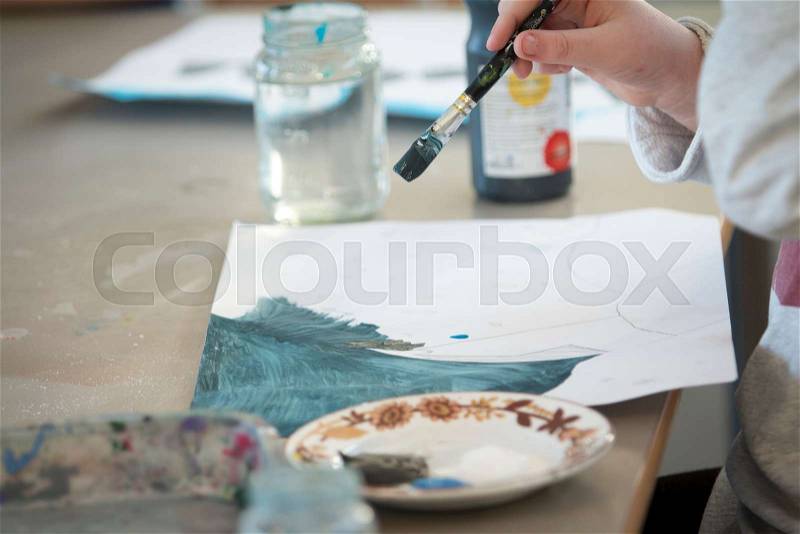 Young students in painting class, stock photo