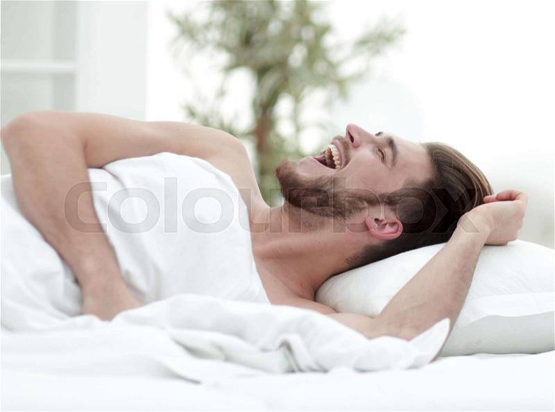 Man falling asleep in the comfortable hotel room.photo with copy space, stock photo