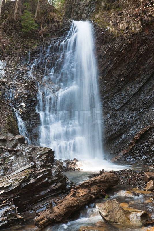 High mountain waterfall in wild Carpathian forest Guk Waterfall, Ivano-Frankivsk Region,, stock photo