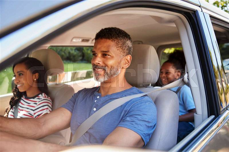 Family In Car Going On Road Trip, stock photo