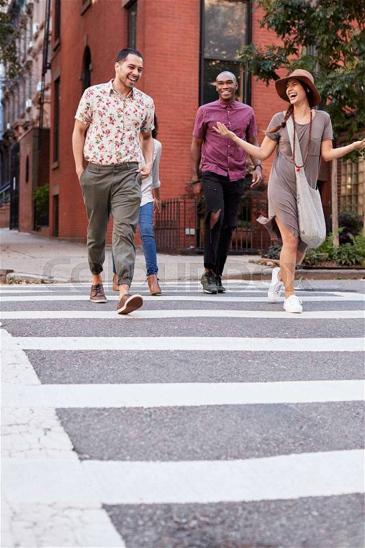 Group Of Friends Crossing Urban Street In New York City, stock photo