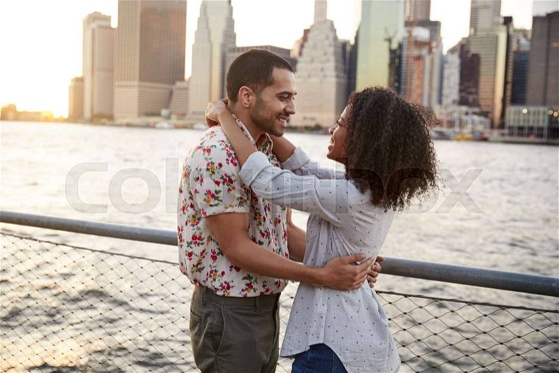 Romantic Young Couple With Manhattan Skyline In Background, stock photo