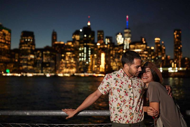 Romantic Couple With Manhattan Skyline In Background At Dusk, stock photo