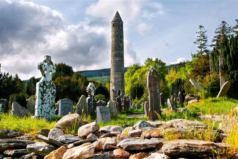 Round tower and cemetery in Glendalough, Ireland , stock photo
