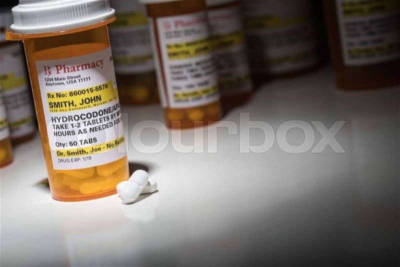 Hydrocodone Pills and Prescription Bottles with Non Proprietary Label. No model release required - contains ficticious information, stock photo