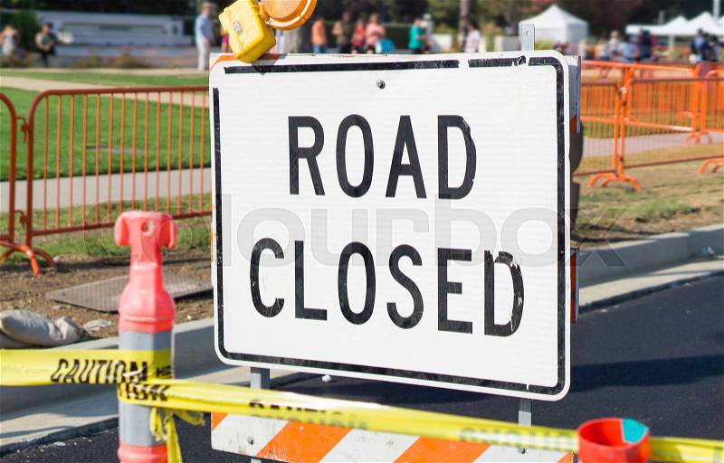 Road closed sign and block in a city street, stock photo