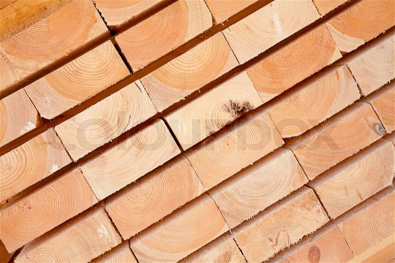 Stack of new wooden studs at the lumber yard, stock photo