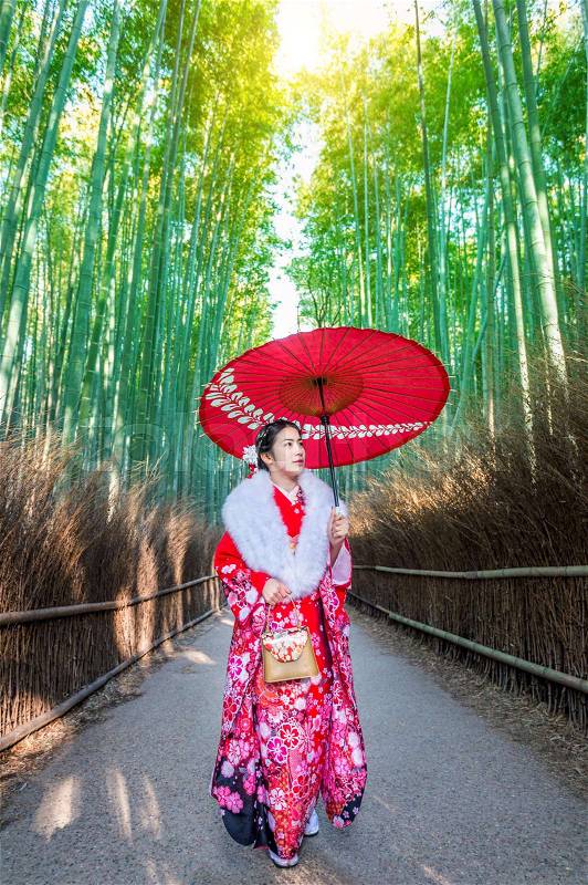 Bamboo Forest. Asian woman wearing japanese traditional kimono at Bamboo Forest in Kyoto, Japan, stock photo