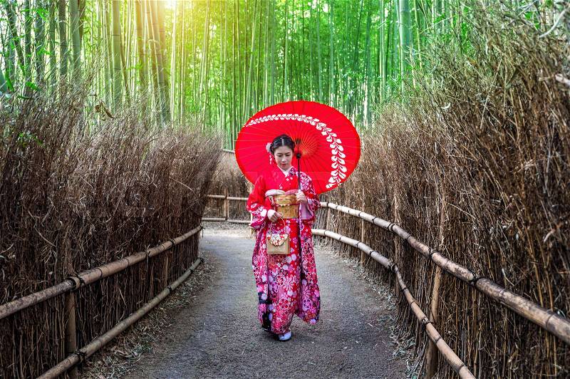 Bamboo Forest. Asian woman wearing japanese traditional kimono at Bamboo Forest in Kyoto, Japan, stock photo