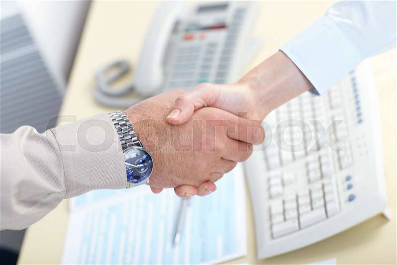 Business handshake. Businessmans working in the office, stock photo