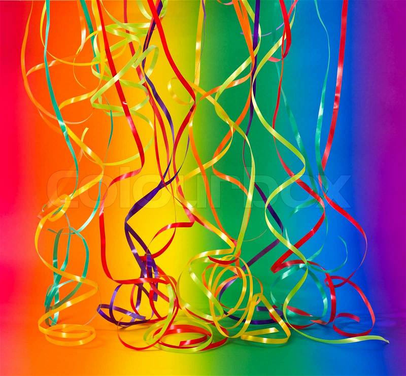 Party decoration. streamer on colorful rainbow background, stock photo