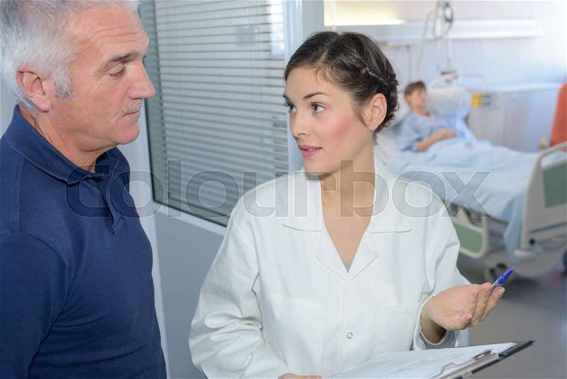 Talking to the patient\'s family member, stock photo