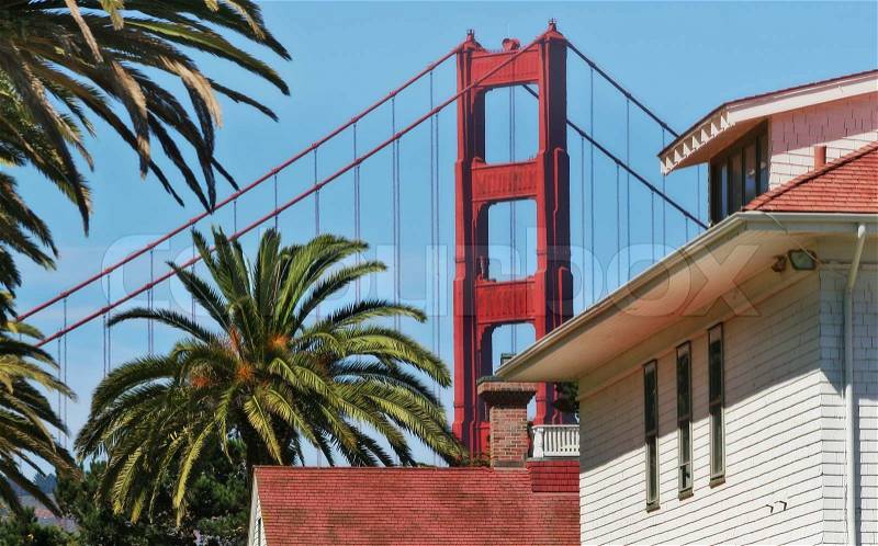 Architectural fragments of famous Golden Gate Bridge and wooden house in San Francisco, USA, stock photo
