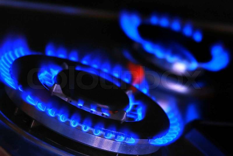 Blue flames of gas stove, stock photo