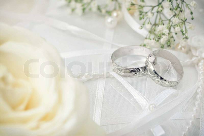 Wedding detail with beautiful white gold rings, stock photo