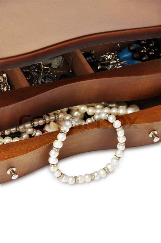 Peals in the wooden jewelry box close up with copy space, stock photo
