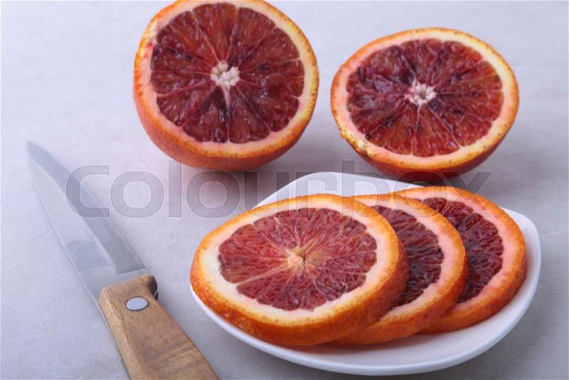 Orange fruit. Orange and lemon slice on white plate. Top view, stock photo