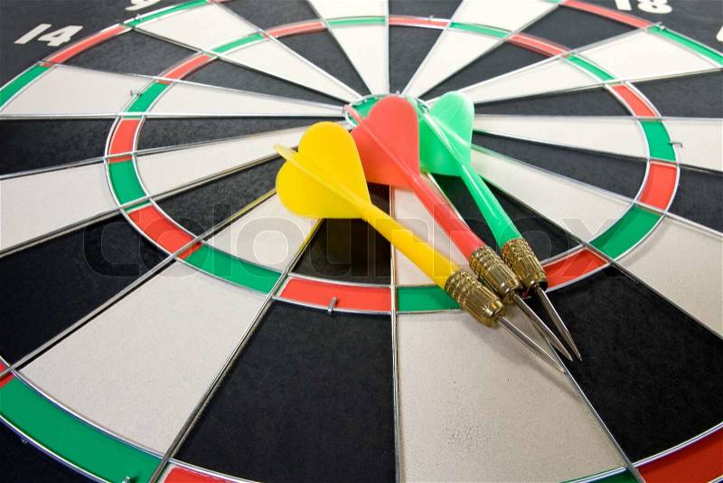 Three color darts on the dart board, stock photo