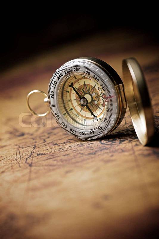Vintage compass and old navigation map, stock photo