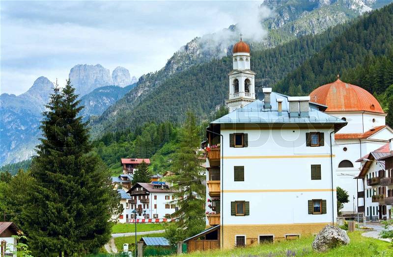 Tranquil summer Italian dolomites mountain village view from Auronzo di Cadore village, stock photo