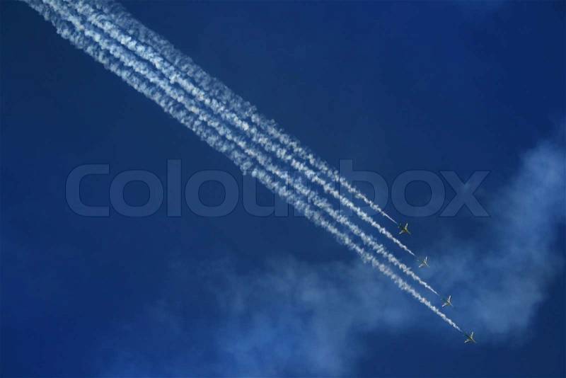 Group of four airplanes making formation, stock photo