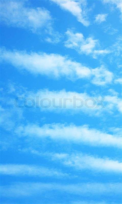 Blue sky background with fluffy clouds & bright light, stock photo