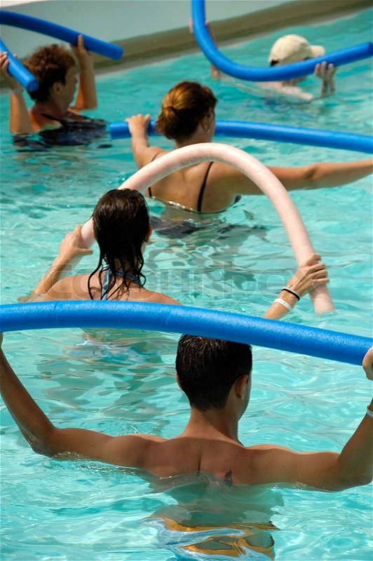 People doing water aerobic in pool, stock photo