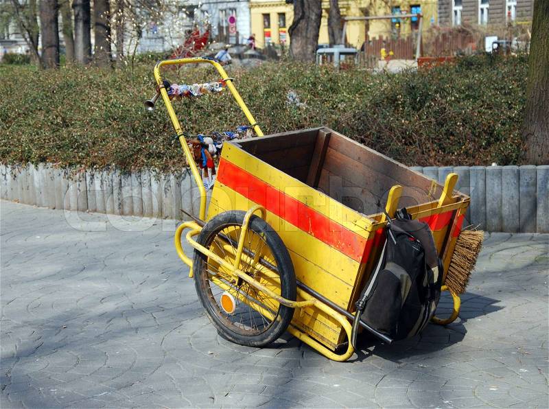 Yellow urban cleaning cart service, stock photo
