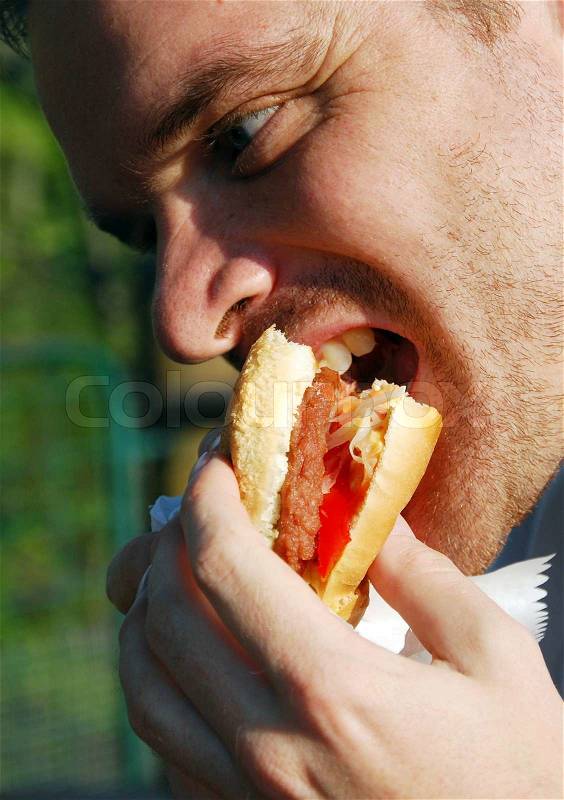 Hungry man eat big hamburger, stock photo