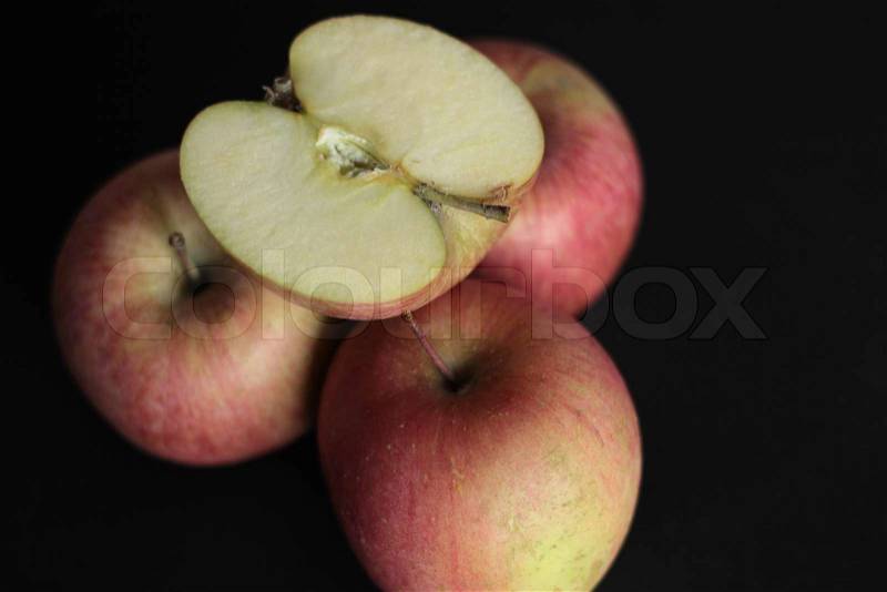 Red apples - three full and one half - red apples, stock photo