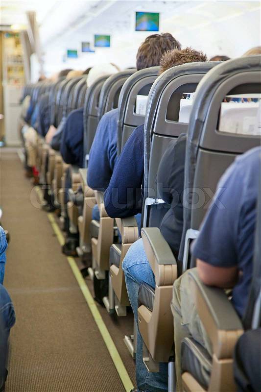 Aircraft cabin after take off, stock photo